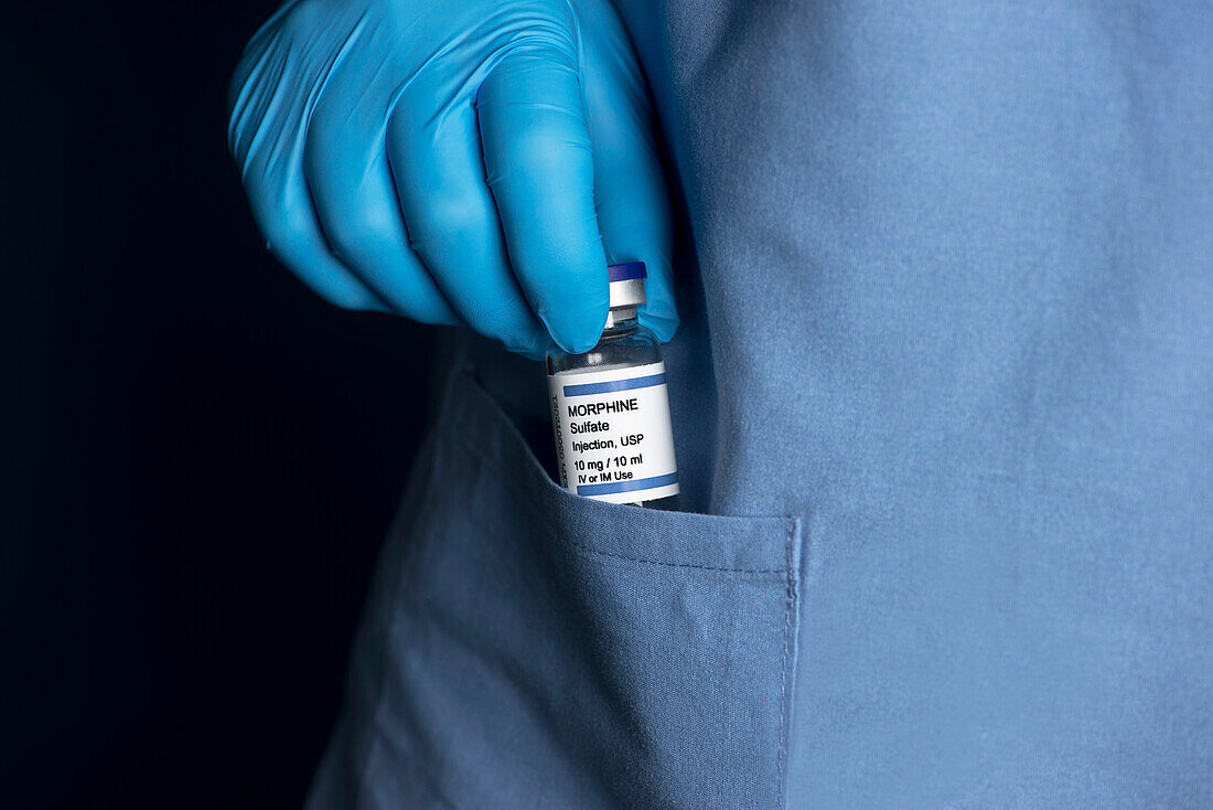 Medication theft by healthcare professional, conceptual image