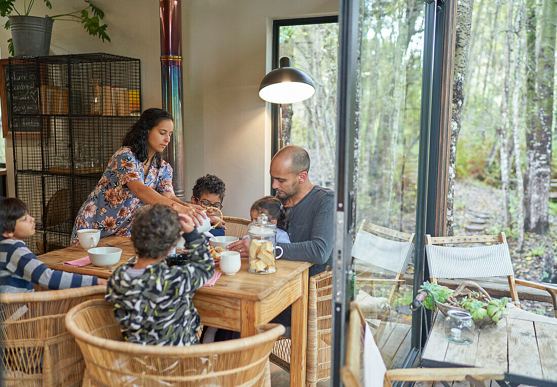 Family eating at dining table in cabin