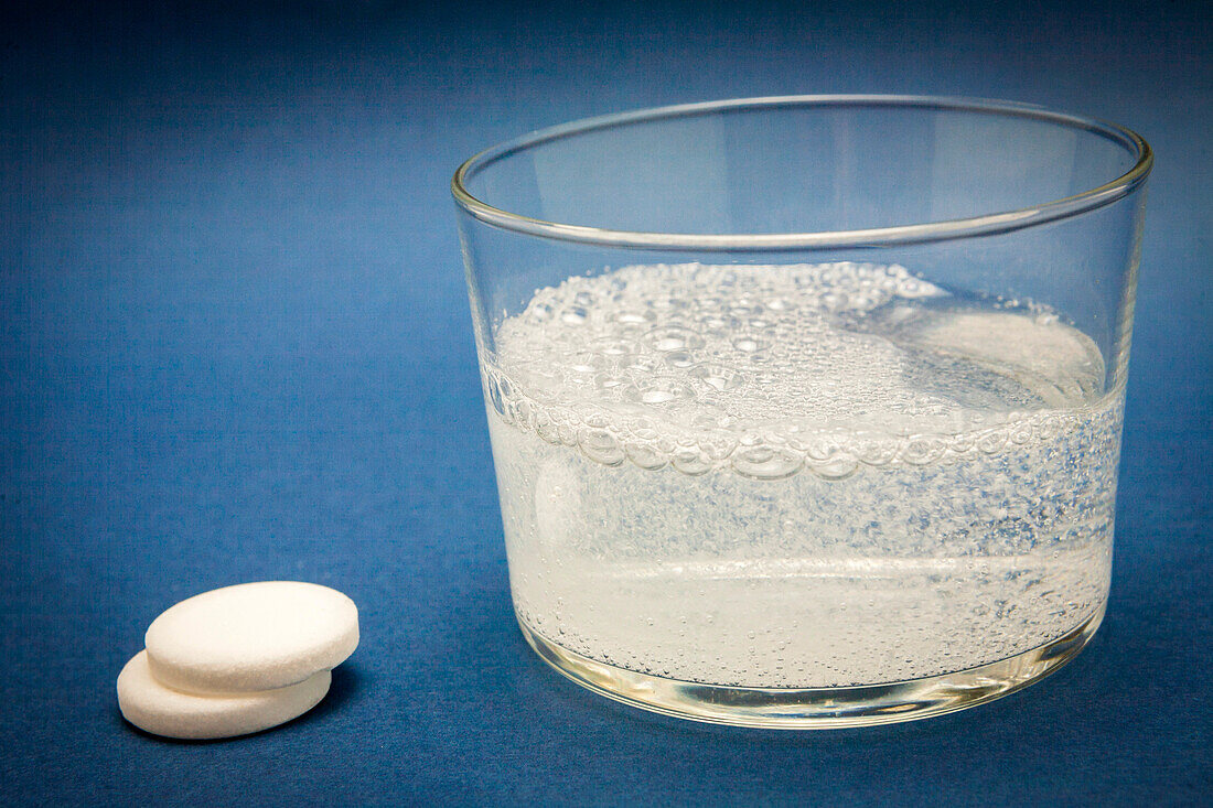 Effervescent tablet into glass of water