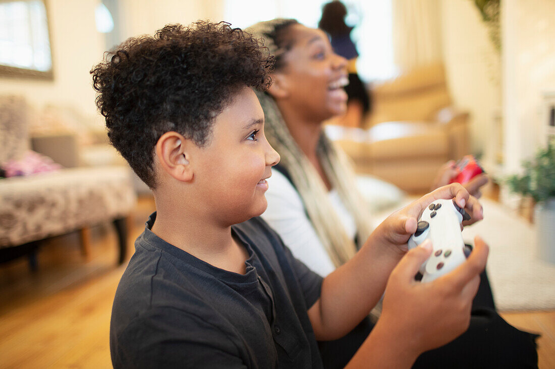 Mother and son playing video game