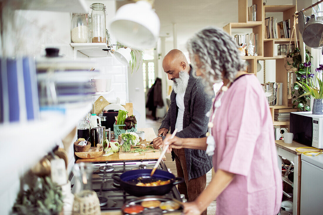 Couple cooking at kitchen stove