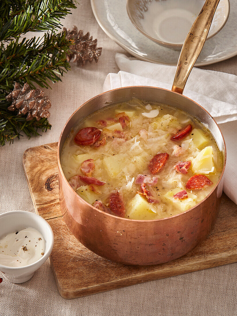 Winter white cabbage soup with sausage