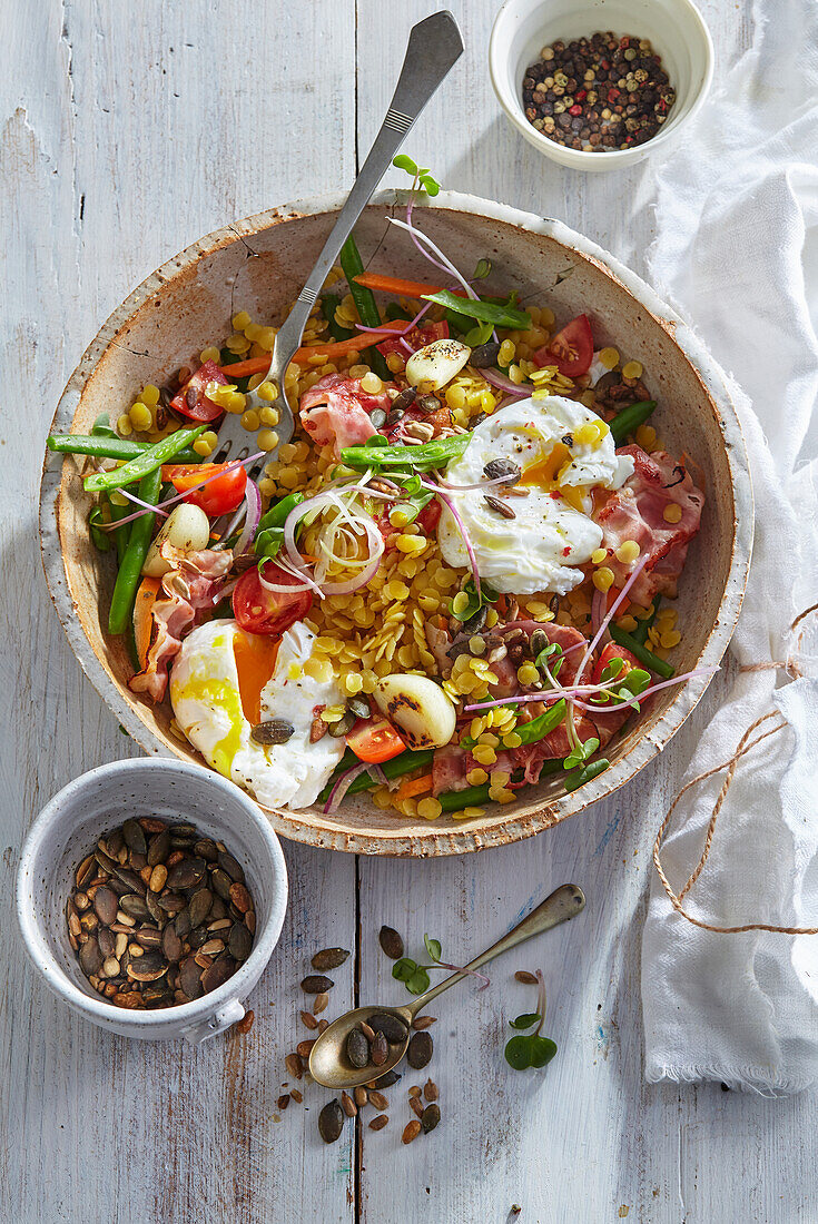 Yellow lentil salad with poached egg