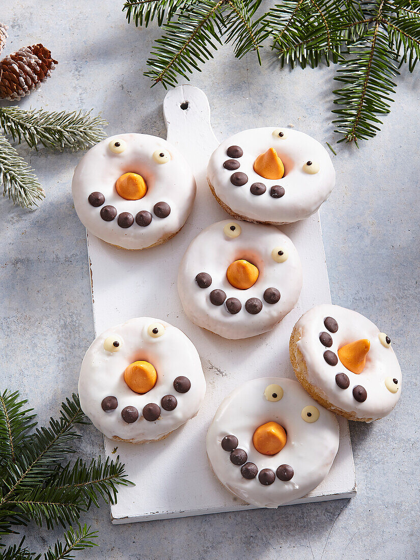 Snowman donuts with white chocolate icing