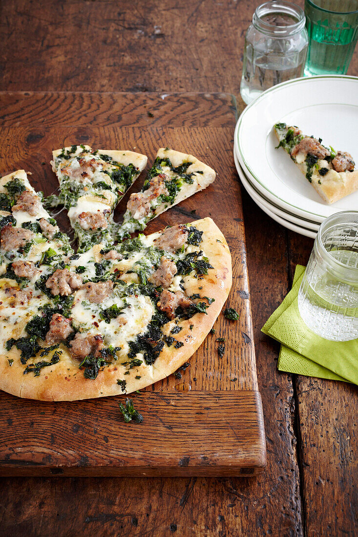 Pizza with kale, sausage, and Taleggio cheese