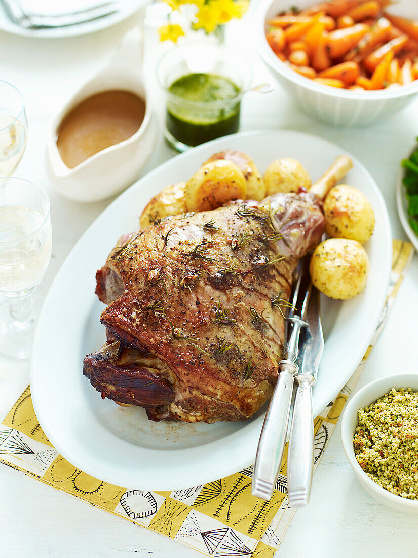 Roasted lamb with spring herb crumbs and side dishes