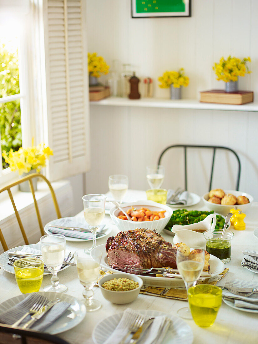 Easter table set with roast lamb