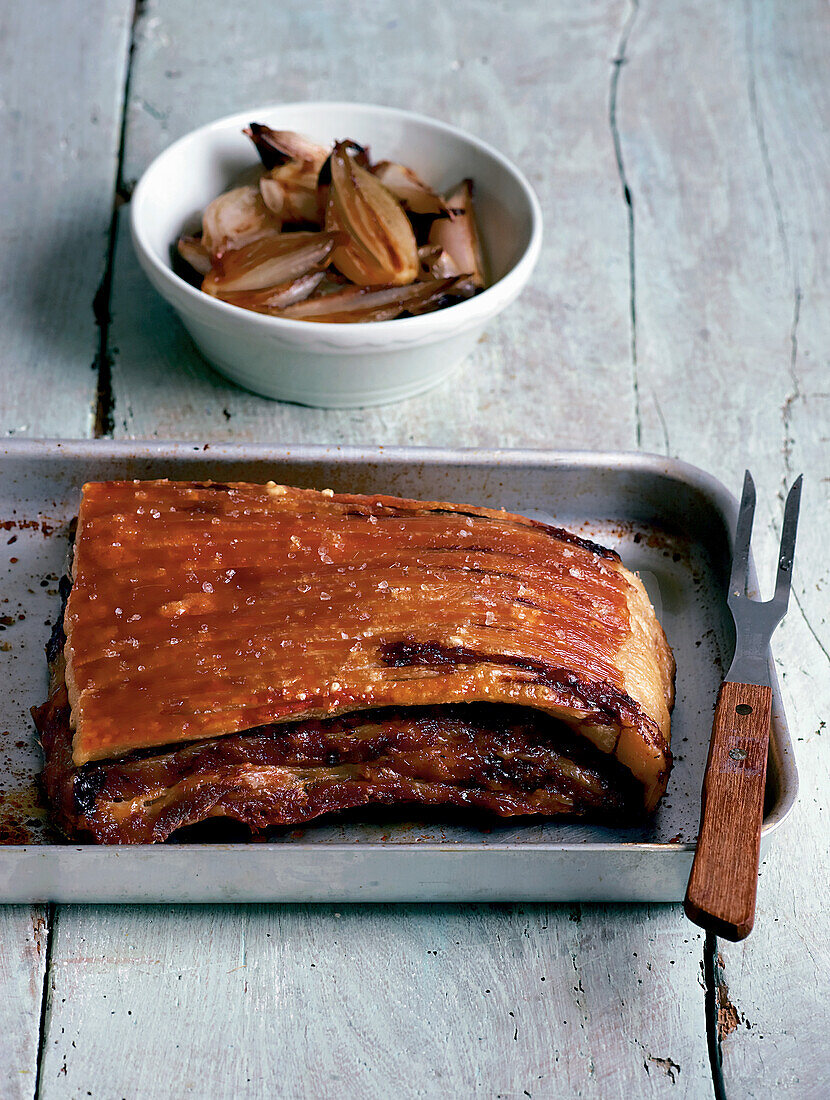 Slow cooked pork belly with caramelized shallots