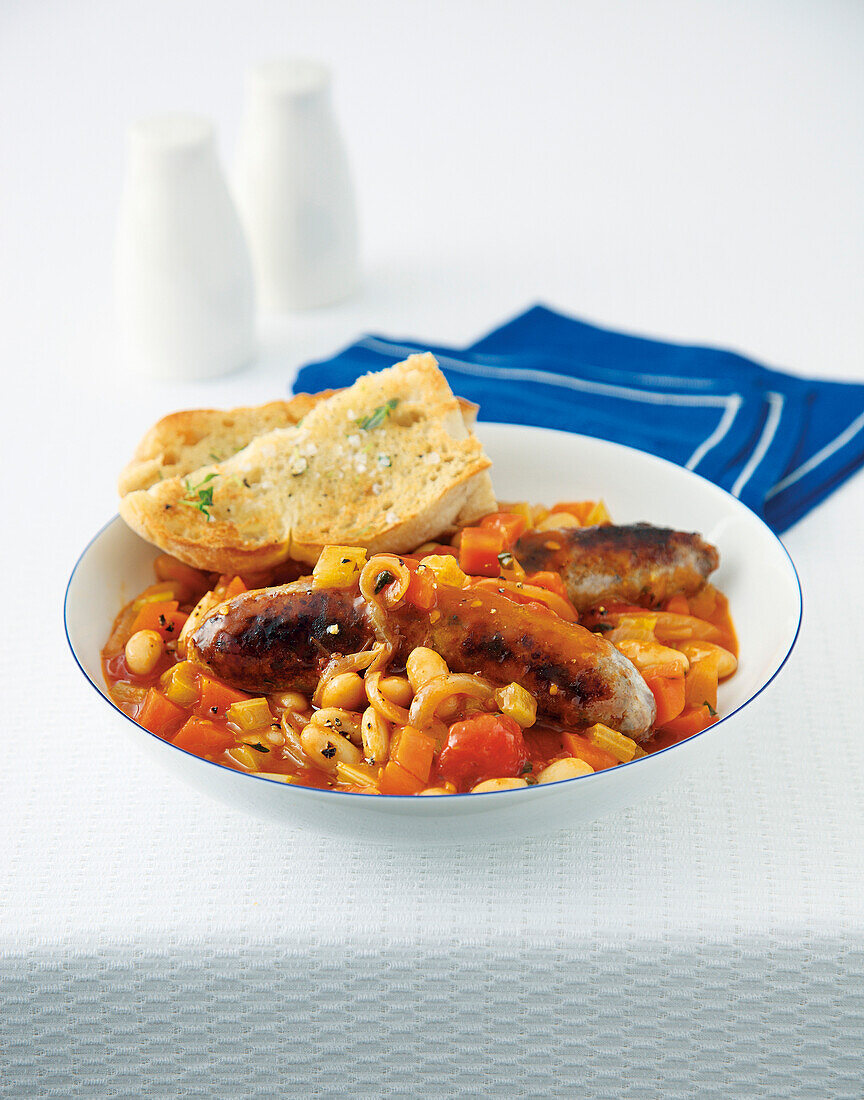 Sausage casserole with white beans and garlic bread