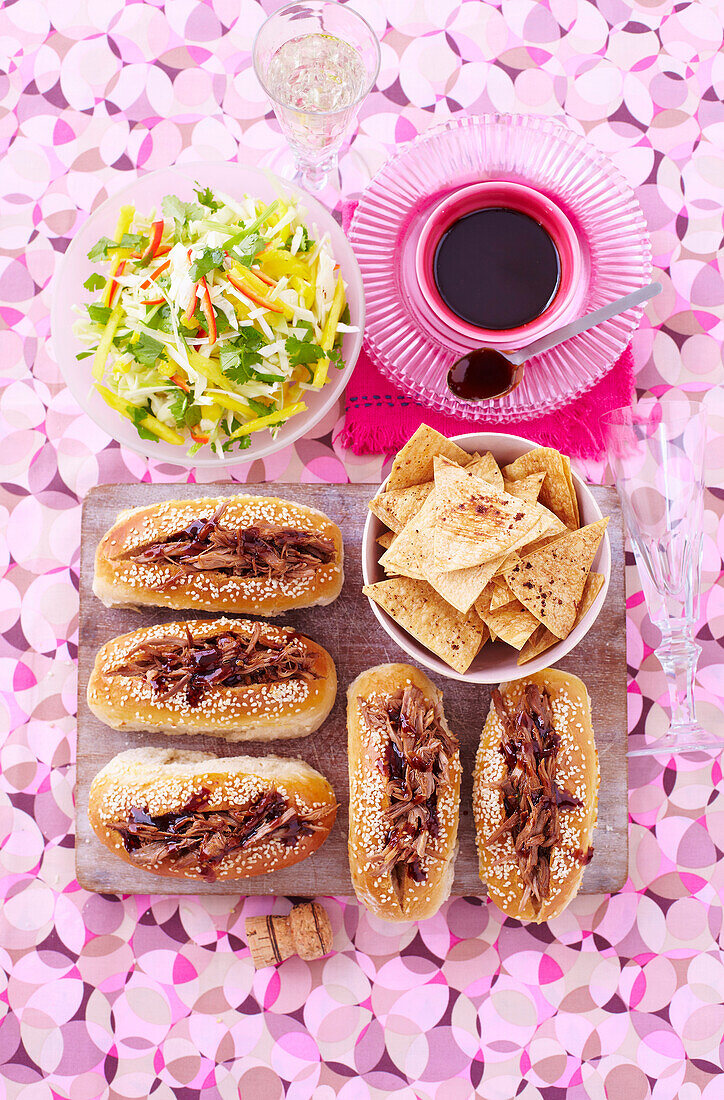 Sticky duck rolls with chopped mango slaw and Chinese chips