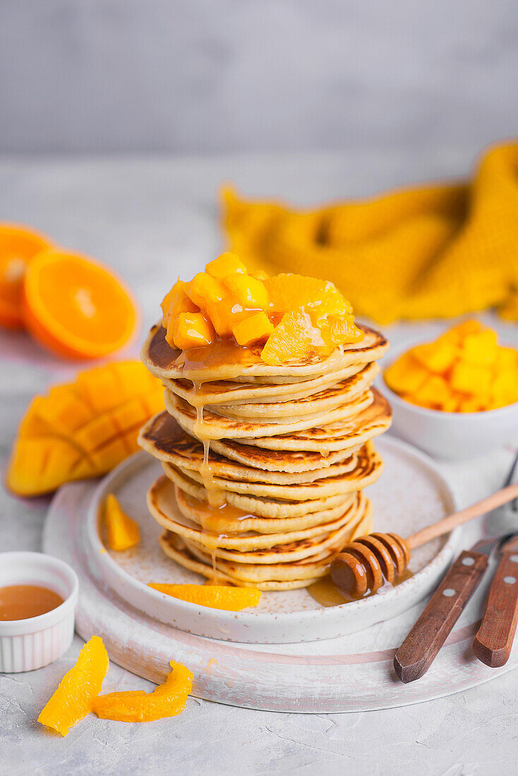 Pancakes with mango and oranges