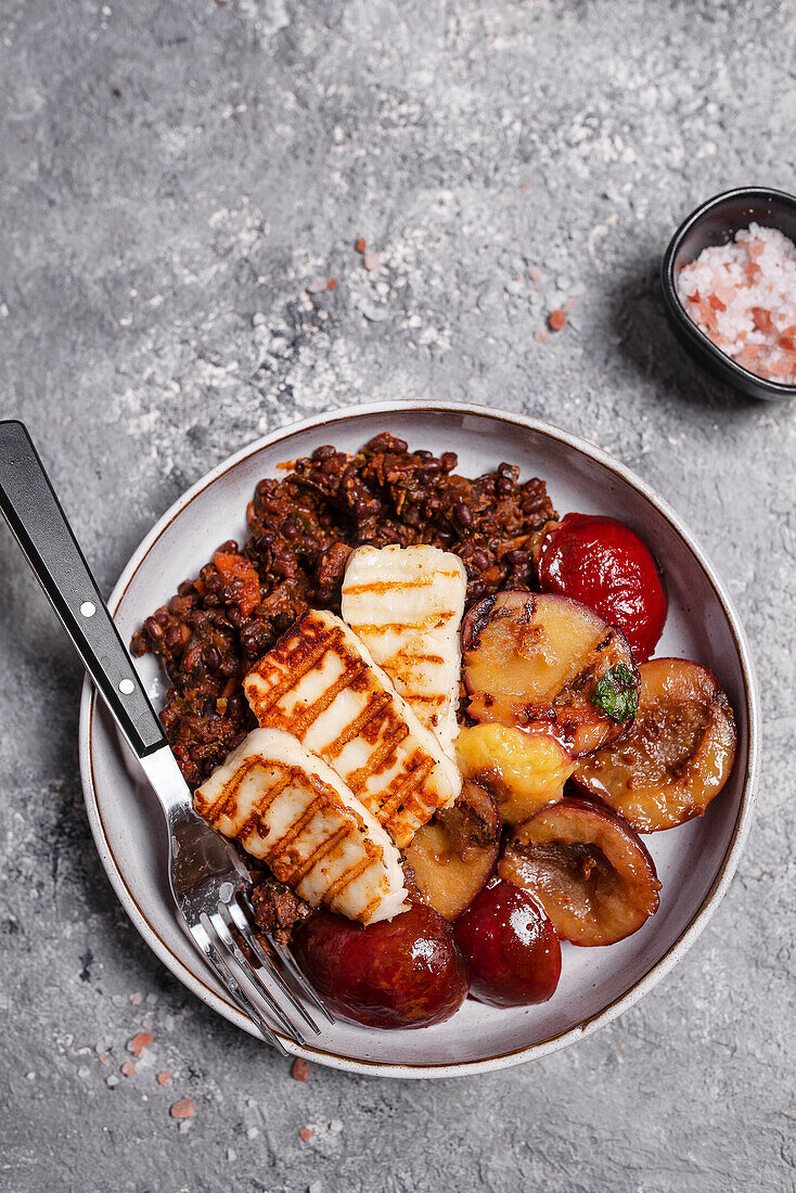 Halloumi with roasted plums, miso, honey, red beans, carrots, and soy sauce