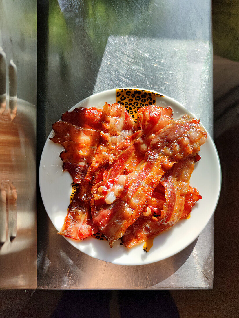 Fried bacon slices on plate