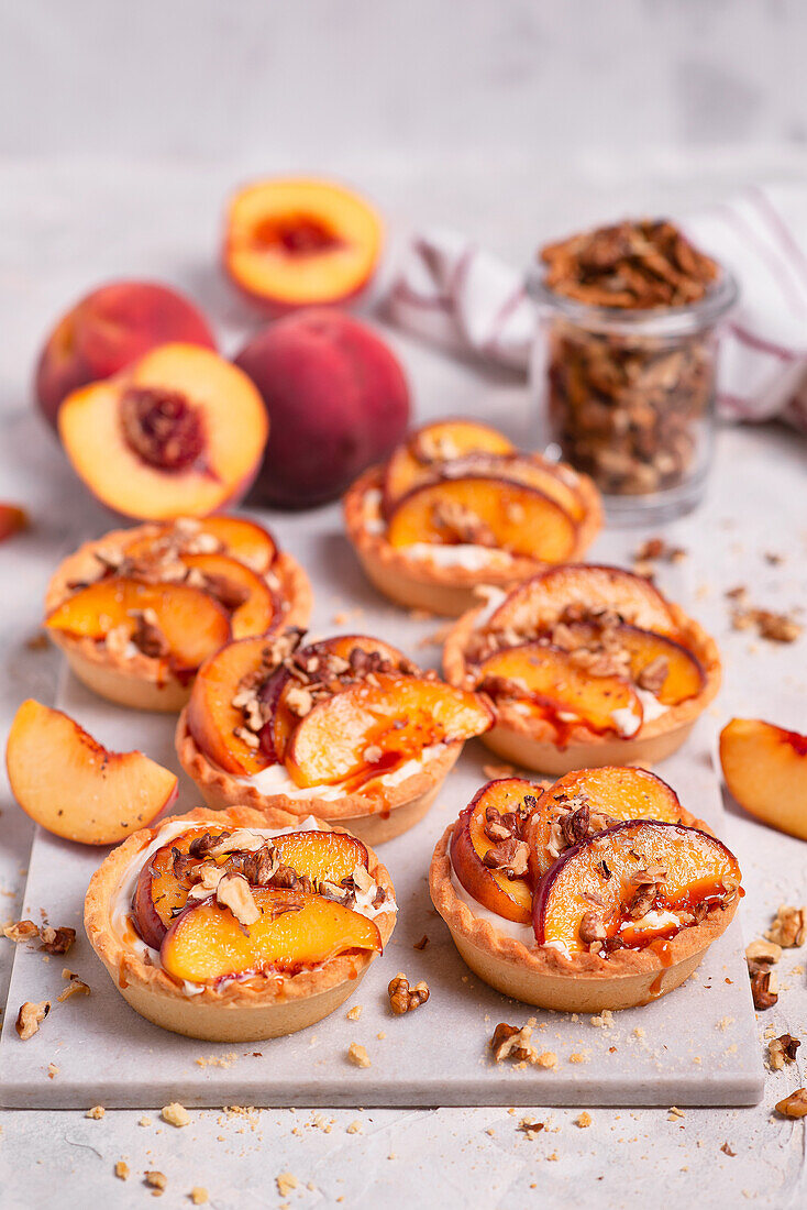 Vanilla cream tartlet with caramelized peach and walnuts