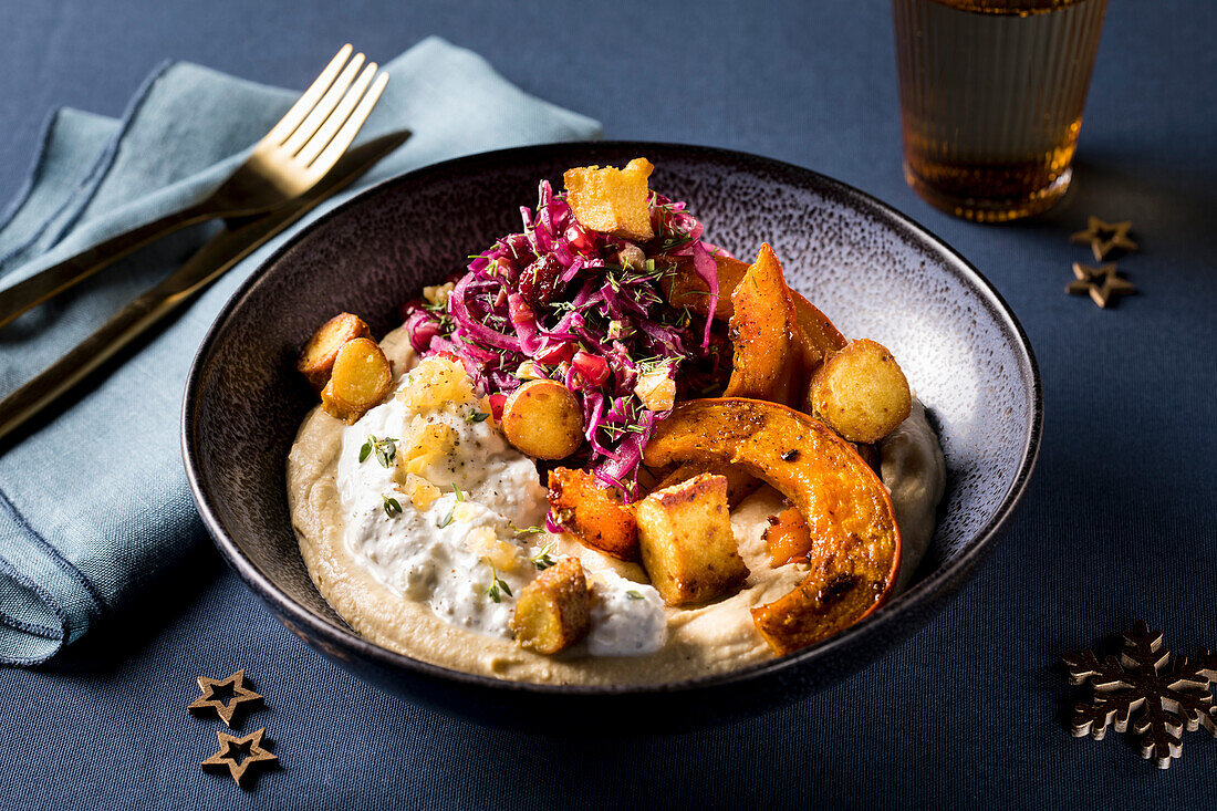 Mezze with hummus, feta cream, salt lemon, baked pumpkin, red cabbage salad and pretzel crunch