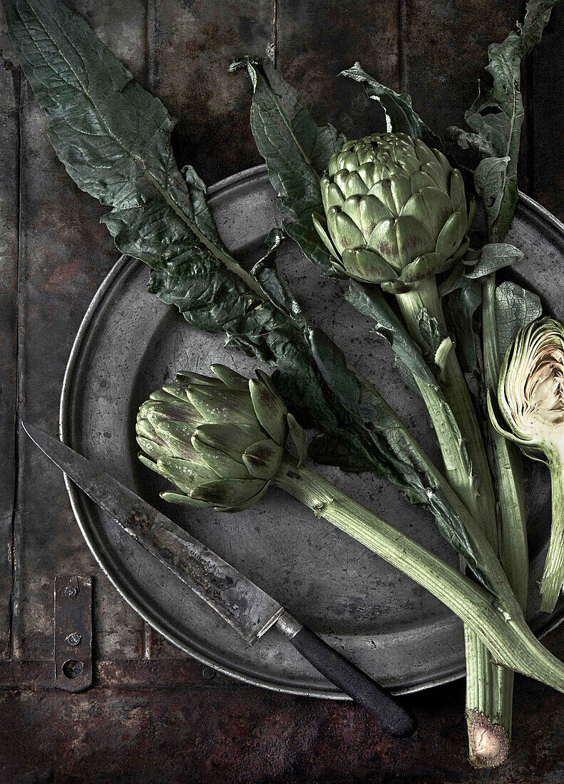 Still life with artichokes on a plate