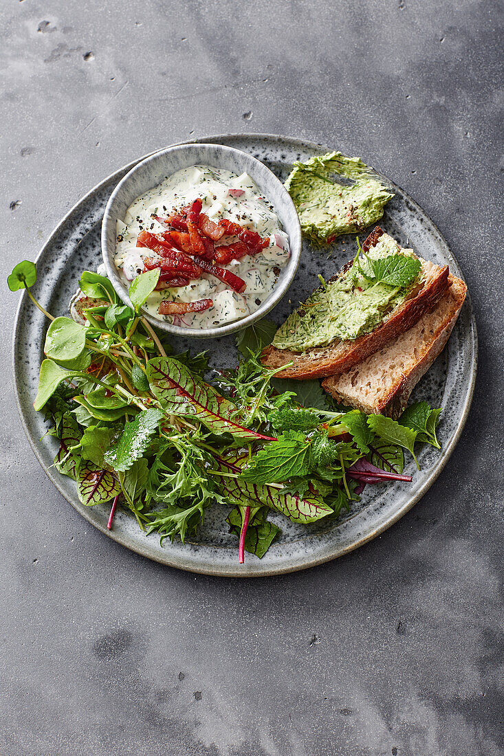 Egg salad with Wagyu bacon served with wild herb salad and herby bread