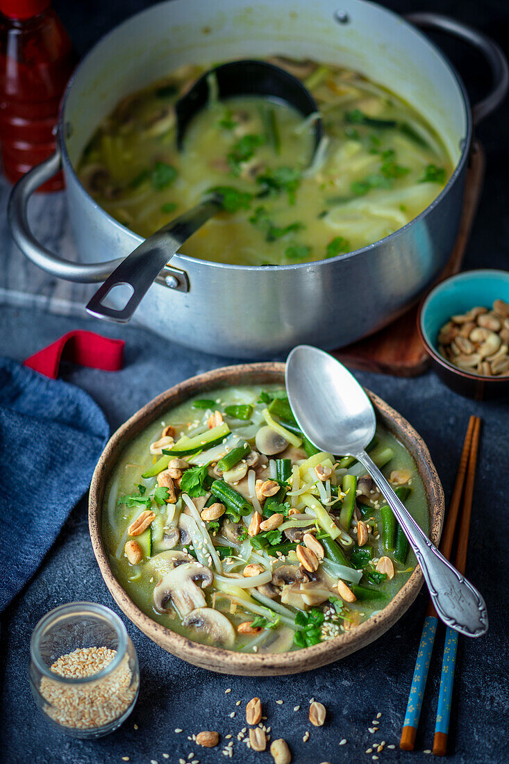 Vegan green curry soup with rice noodles