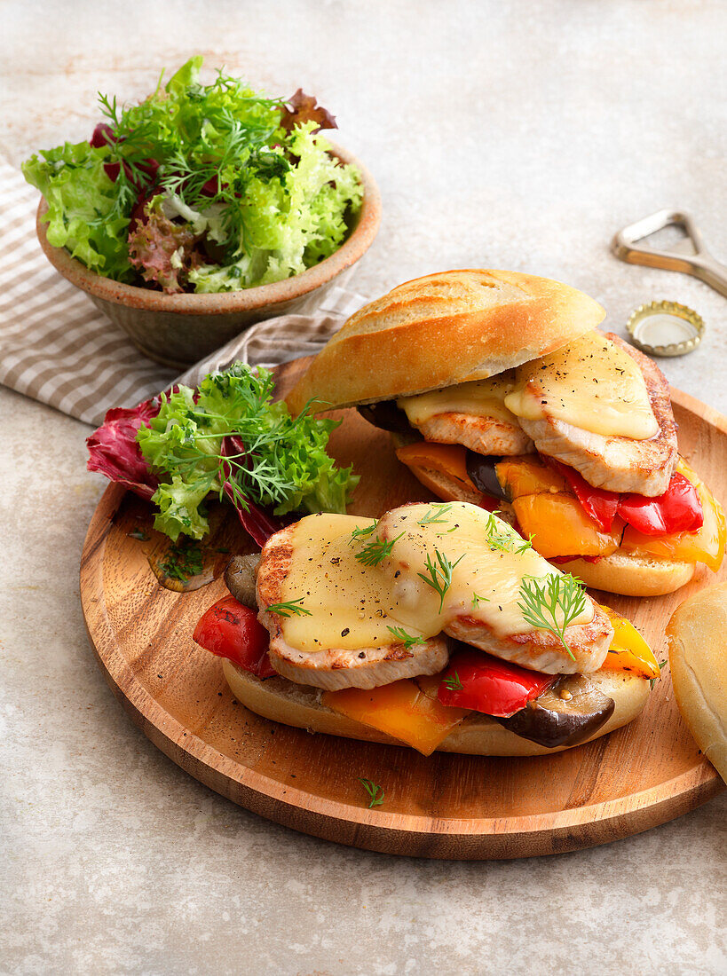 Raclette baguette with pork steaks and vegetables