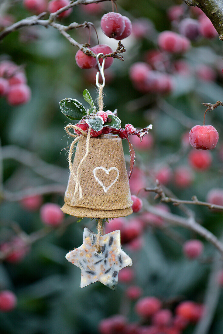 A bird feeder made from seed pots