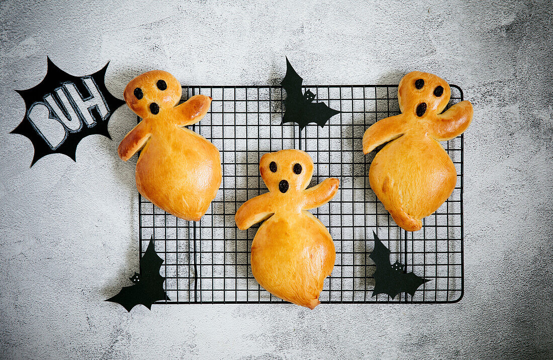 Halloween bread ghosts on a cooling rack