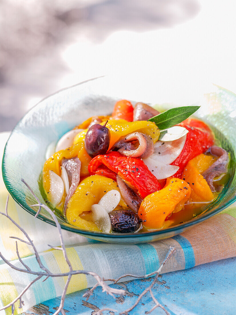 Pepper salad with anchovies and olives