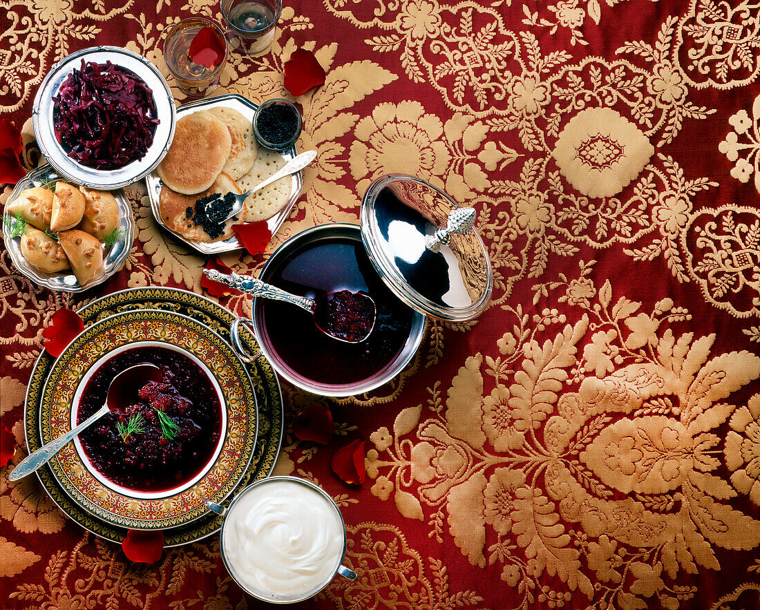 Russian delicacies – borscht, blinis with caviar and piroshki