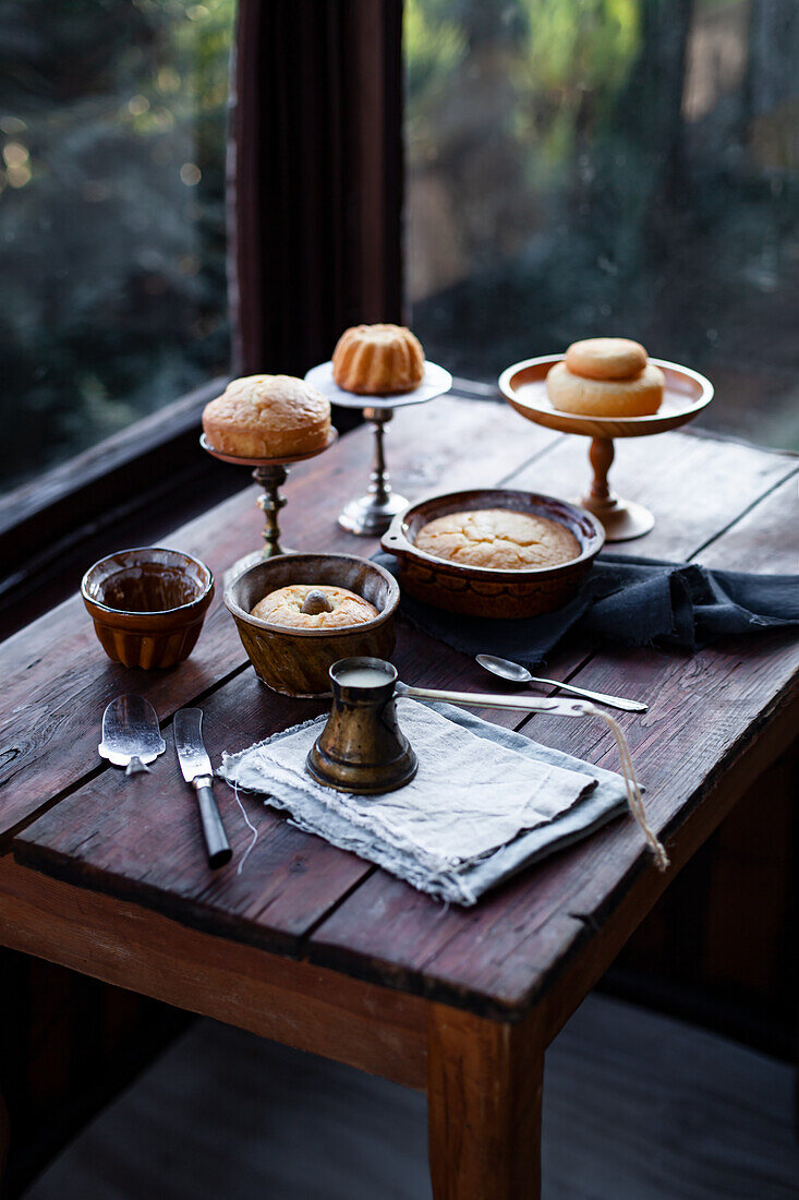Various mini bundt cakes on rustic wooden table