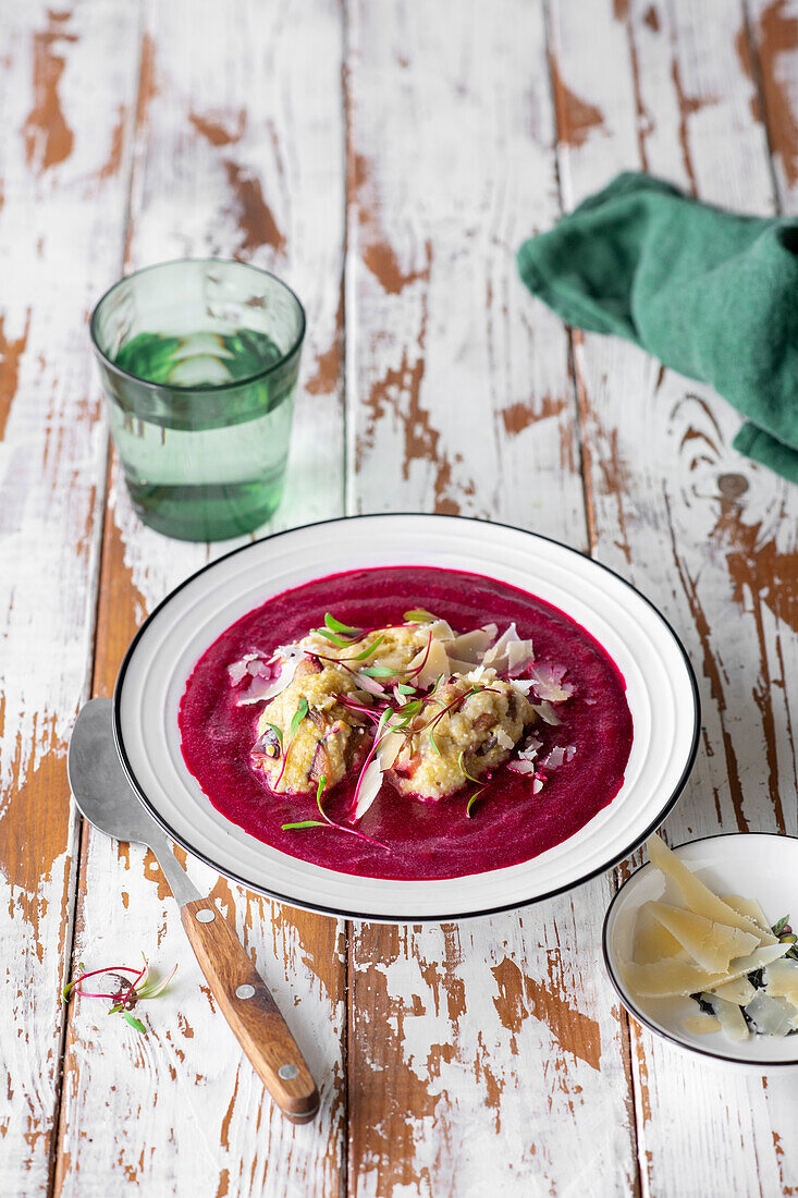 Beetroot soup with plums and polenta dumplings