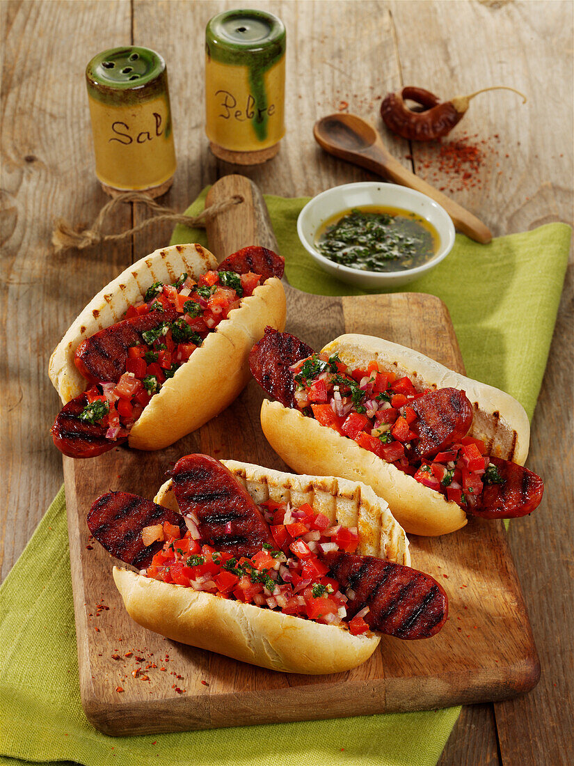Argentinian hot dogs with tomato salsa and chimichurri