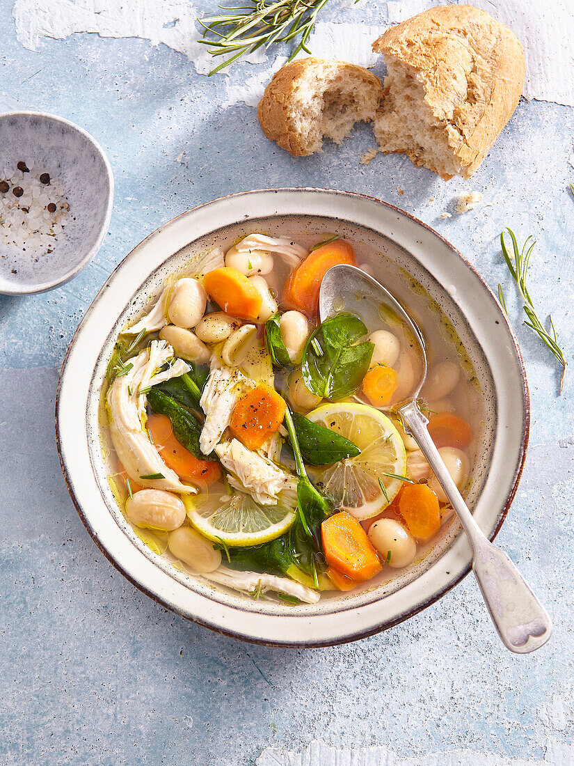 Greek chicken soup with lemon, carrots, and white beans