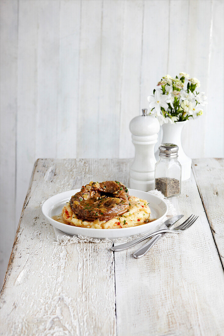Braised veal with garlic and smoky onion mash