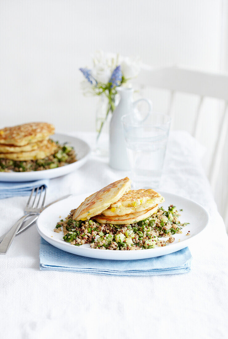 Corn pancakes on grain salad