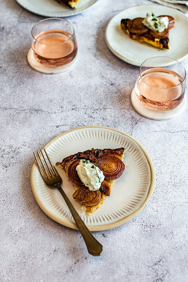 Tarte Tatin of roasted red onions and garlic, served with herb labneh