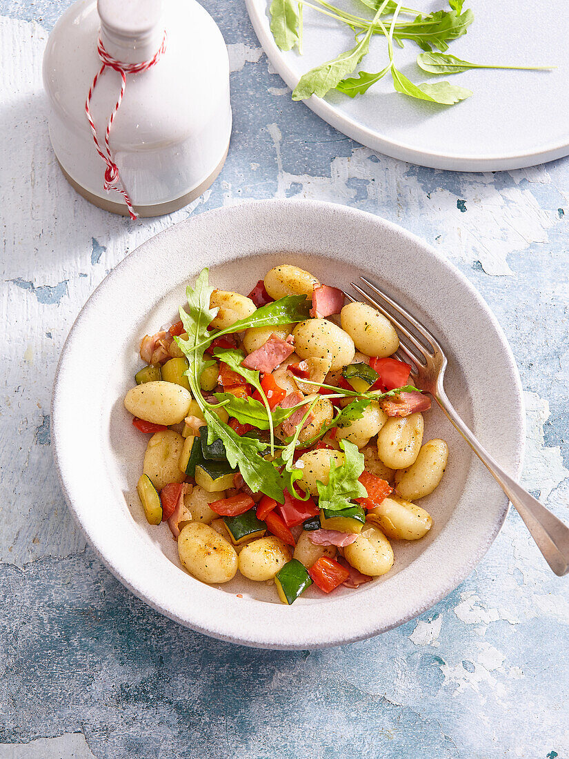 Potato gnocchi with vegetables and dried ham