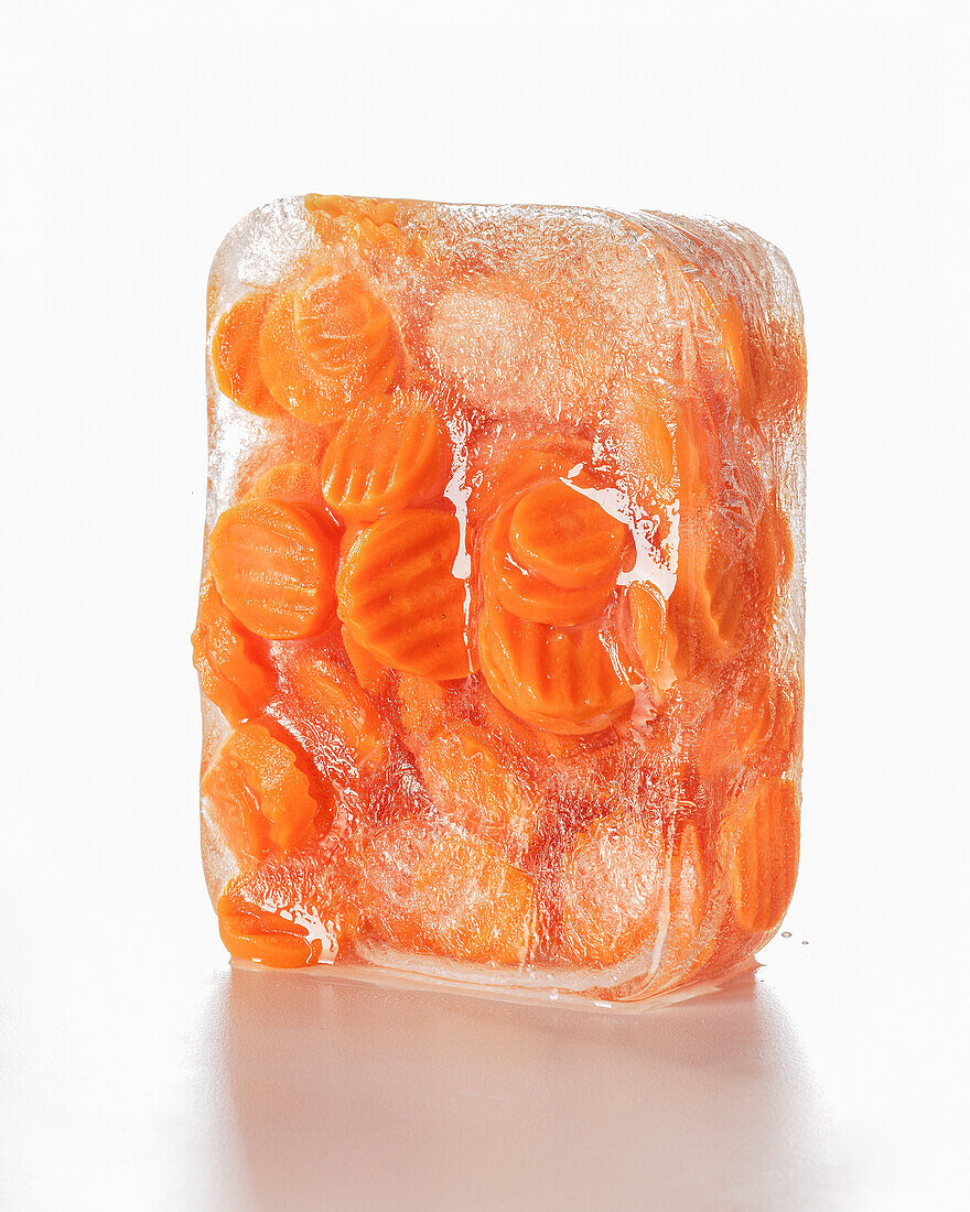 Carrots frozen in a block of ice