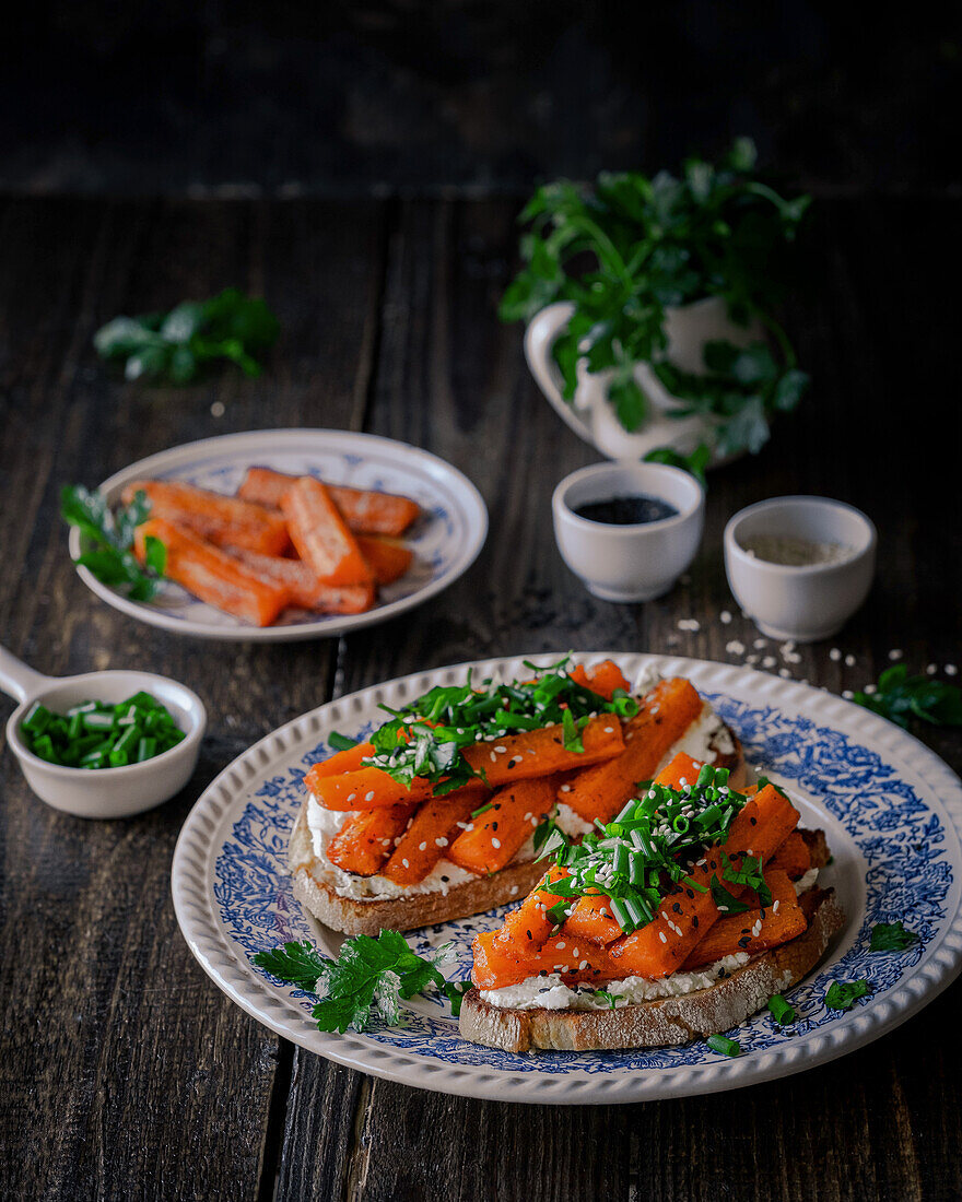 Sandwiches with roasted carrots, cream cheese, herbs and honey