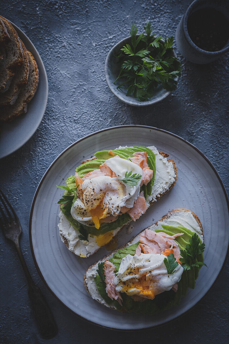 Sandwiches with poached egg, avocado and smoked salmon from above
