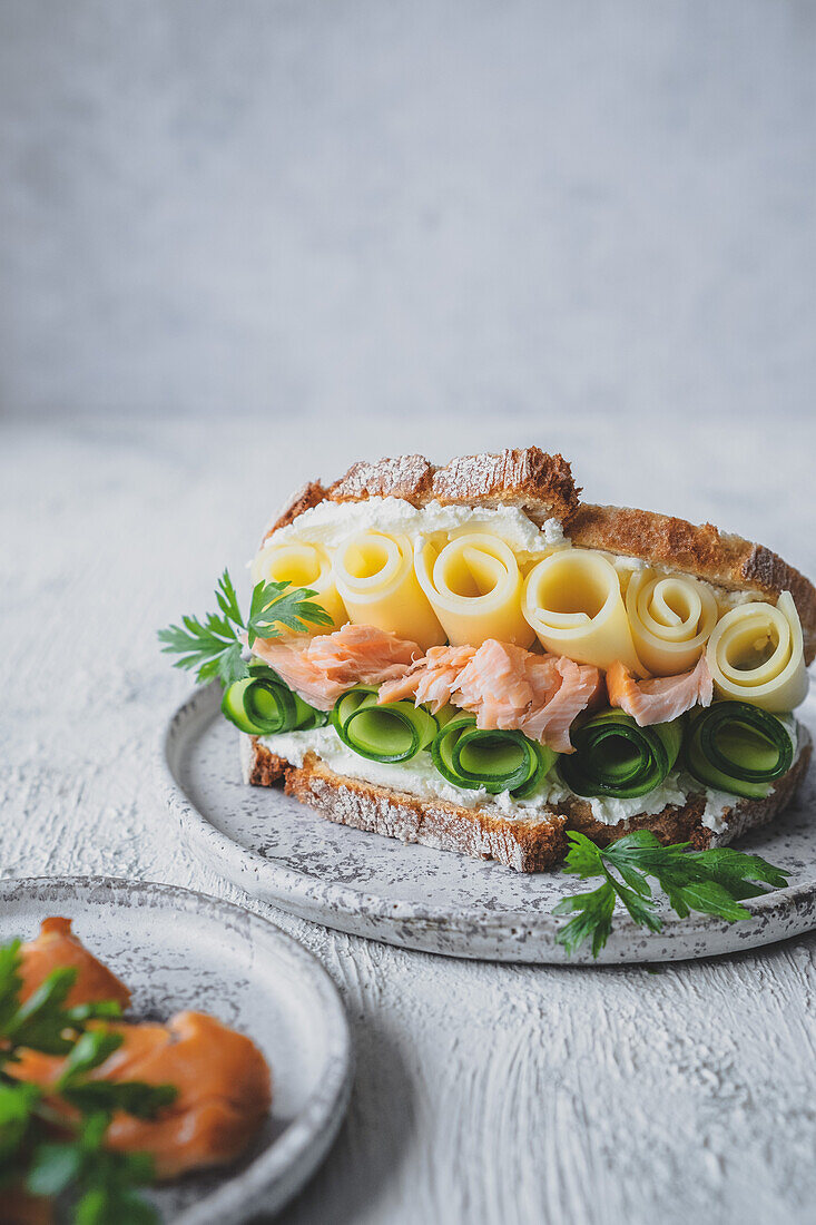Sandwich with cucumber, smoked salmon and cheese