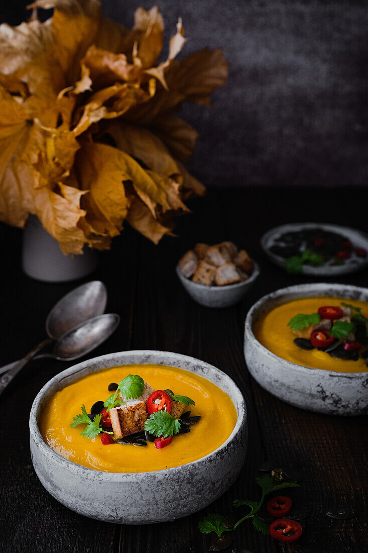 Pumpkin soup with croutons, coriander and chilli