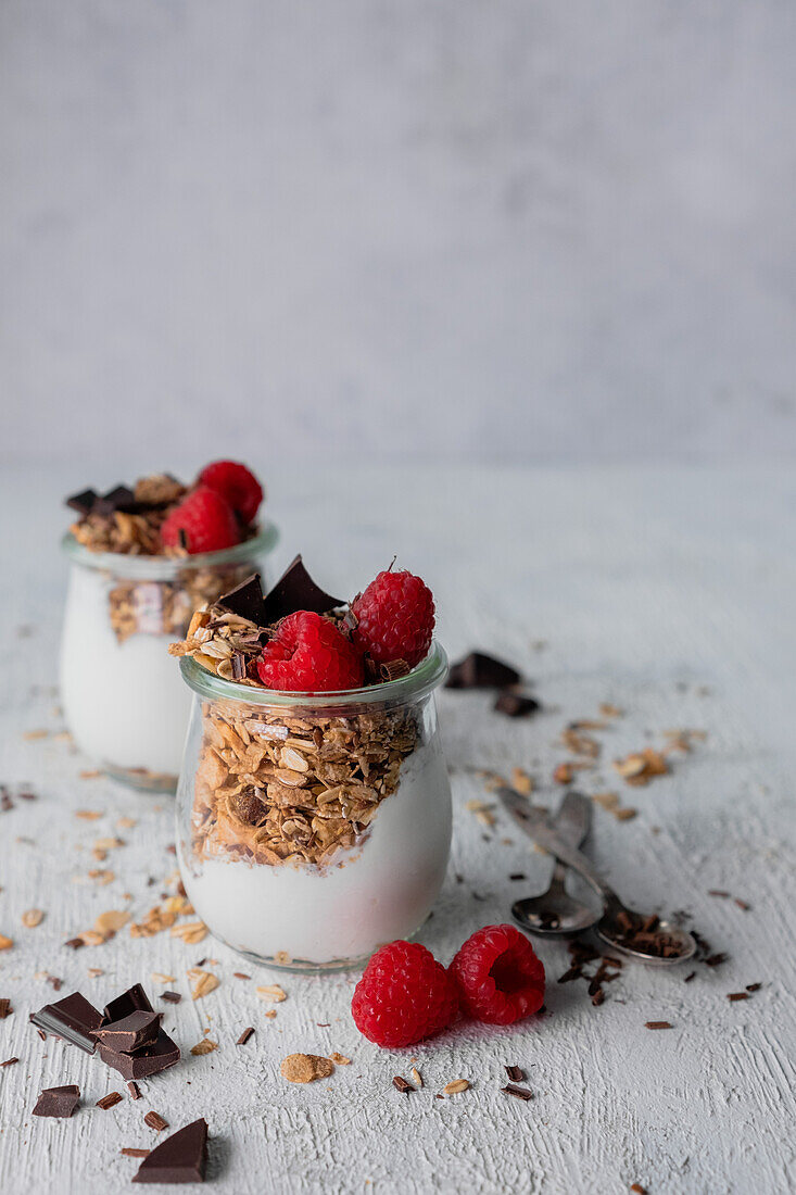 Yogurt with granola, raspberries and chocolate