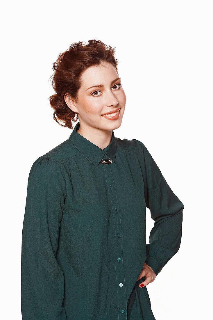 A brunette woman wearing a dark shirt blouse