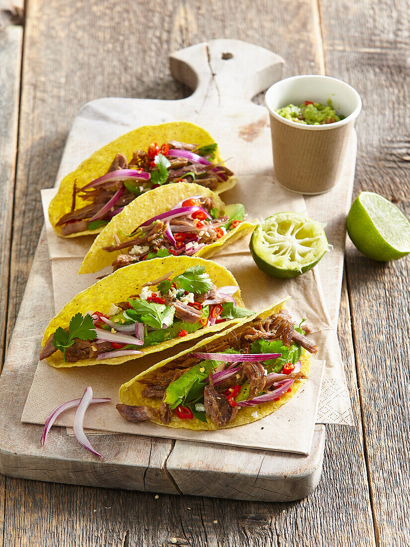 Mexican tacos with avocado and shredded beef