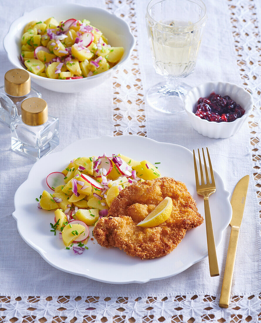 Wiener schnitzel with potato salad and cranberries