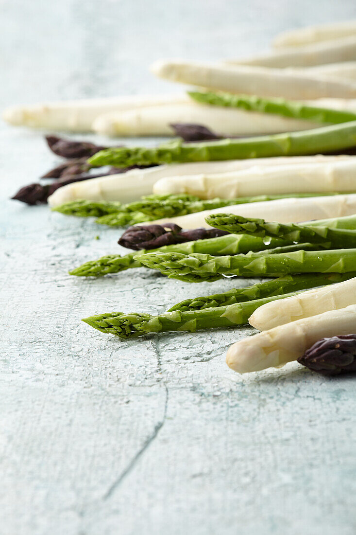 White, green and purple asparagus spears