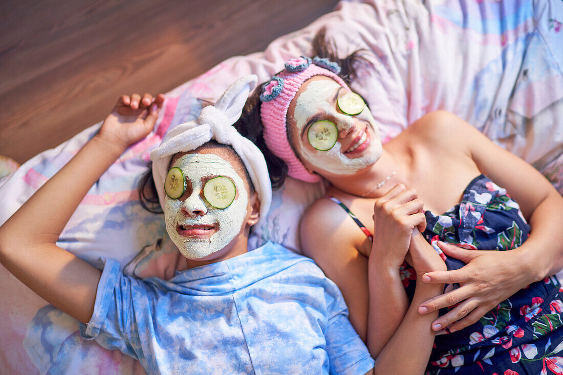 Mother and disabled daughter relaxing with facials