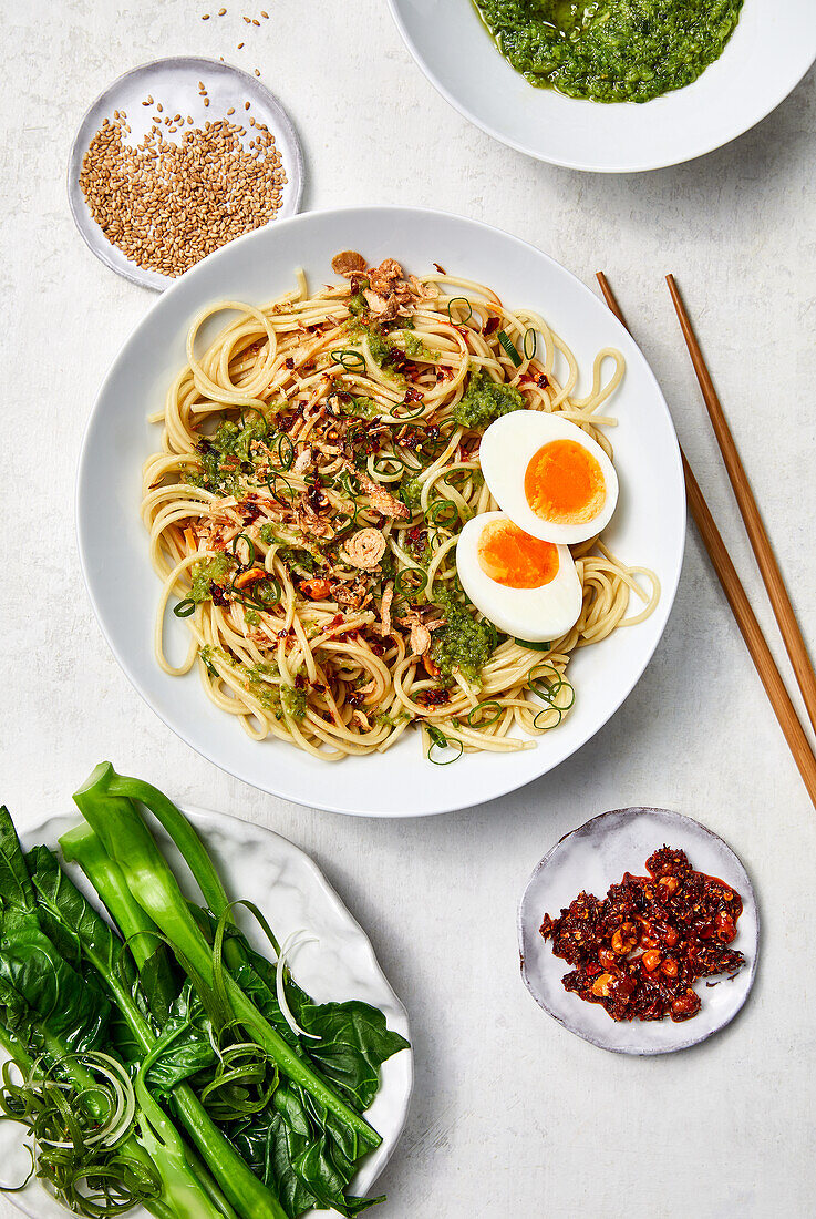 Chinese noodles with chilli sauce, shallots and boiled egg