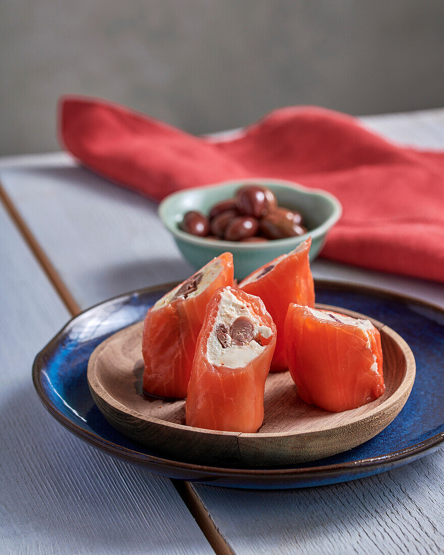 Salmon rolls with black olives