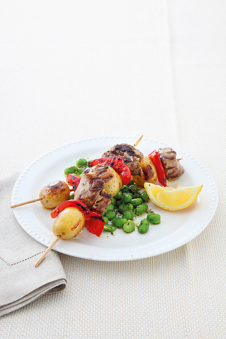 Lamb and potato kebabs with minty broad beans