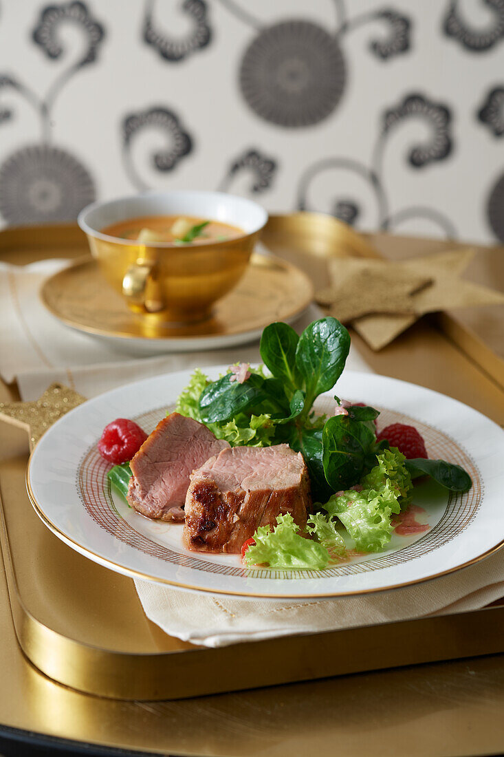 Rapunzel salad with pork fillet and raspberries for Movie Night